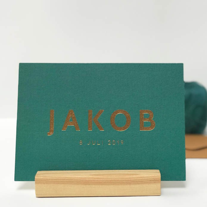 Groen geboortekaartje met bronskleurig folie