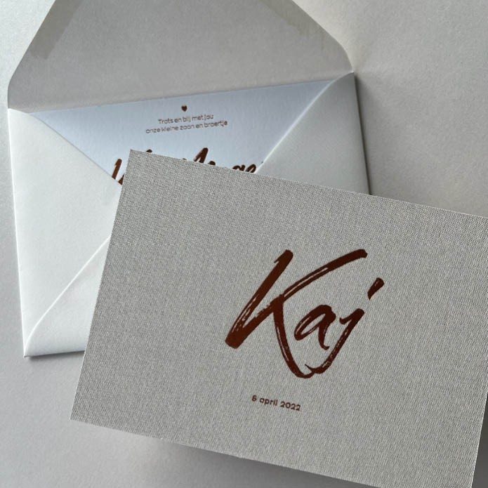 Écht linnen geboortekaartje met matte koper foliedruk